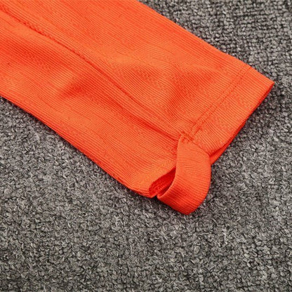 25/26 FC Barcelona Training Orange/Blue Kids Size Tracksuit from FootballPrestige.com - Premium Football Kits