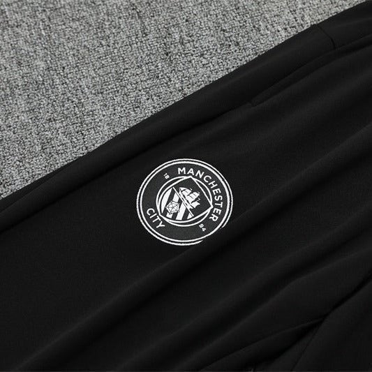 25/26 Manchester City x Asahi Black Tracksuit from FootballPrestige.com - Premium Football Kits