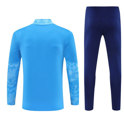 25/26 Manchester City x Asahi Blue Tracksuit from FootballPrestige.com - Premium Football Kits