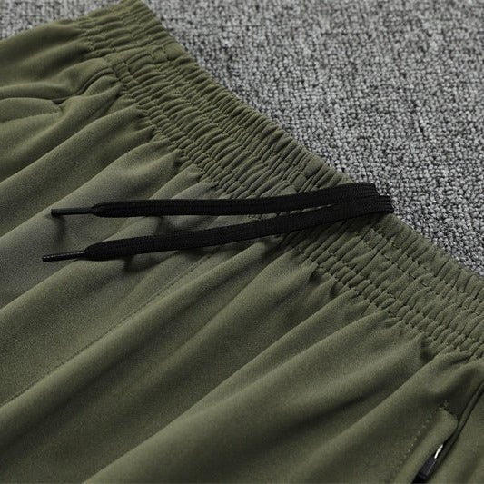 25/26 Real Madrid Training Dark Olive Tracksuit from FootballPrestige.com - Premium Football Kits